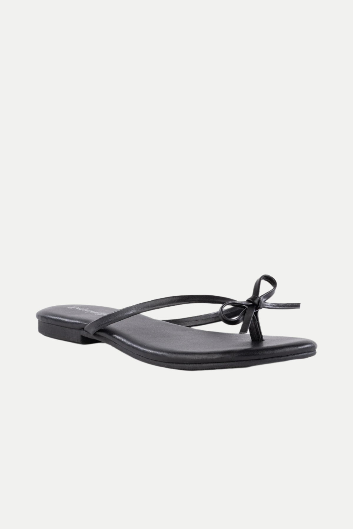 The Wish List Bow Thong Sandal is a black flat sandal featuring thin straps and a small bow on the front, shown against a white background.