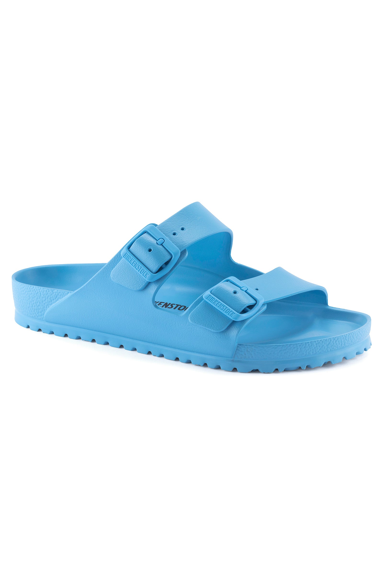 The Womens Arizona Sky Blue Eva Slide Sandal features two adjustable buckle straps and a textured sole inspired by the classic Birkenstock footbed, shown here in light blue on a white background.