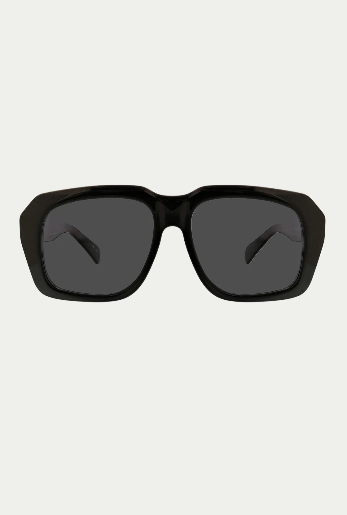 The Andros Sunglass features a bold rectangular black acetate frame and dark tinted lenses offering 100% UVA/UVB protection. Displayed front-facing on a white background.