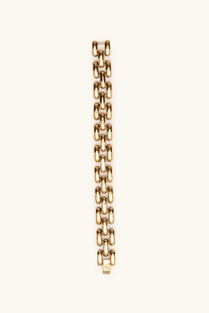 The Phoebe Bracelet is a gold chain-link accessory with a bold, chunky design, showcased vertically against a plain light backdrop.