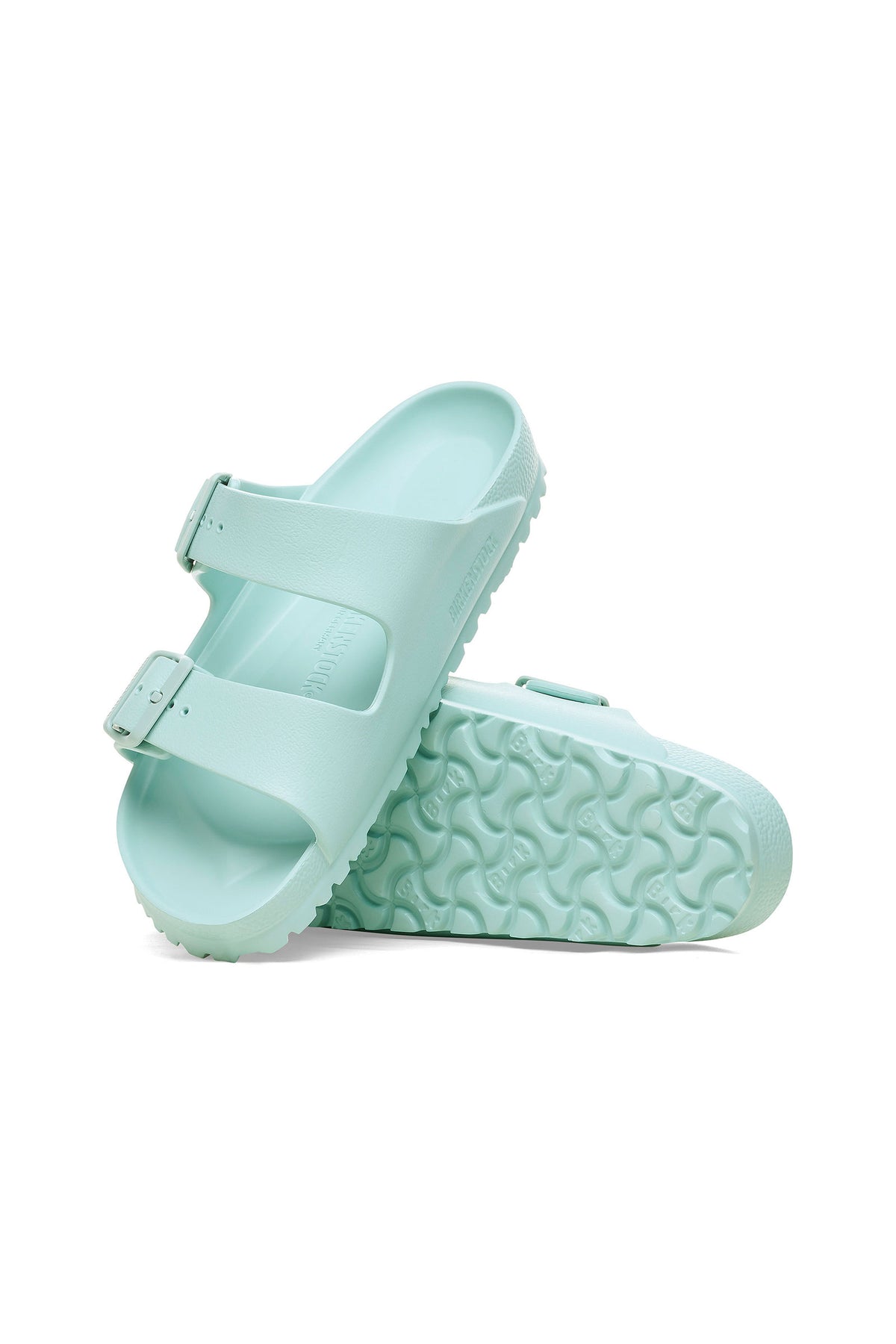 A pair of Mens Arizona Green Eva Slide Sandals, featuring lightweight turquoise EVA material, two buckled straps, and a textured sole—one sandal flat and the other upright to display the design.