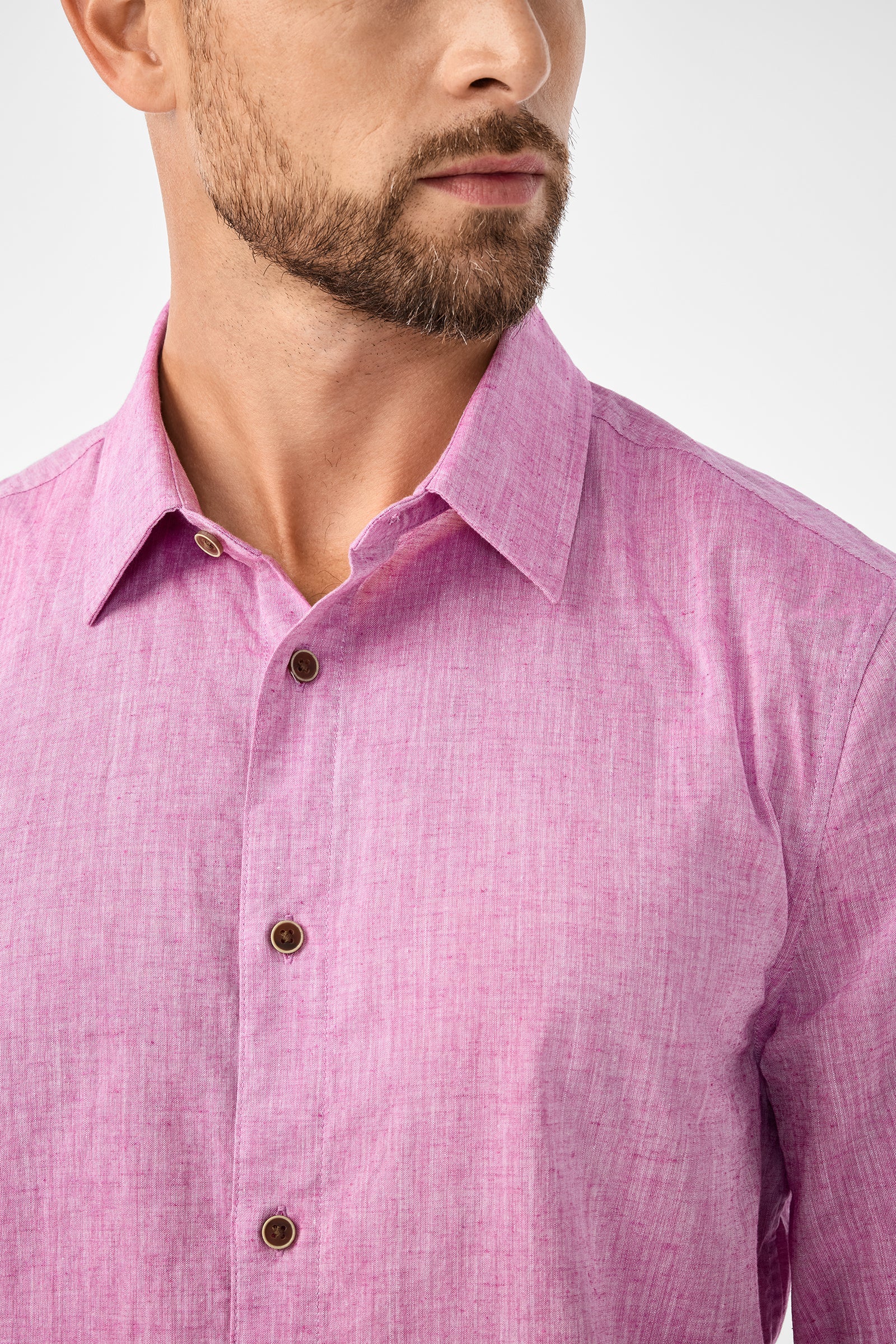 A man with a trimmed beard wears the Aaron Slim Fit Long-Sleeve Shirt (Geranium), shown from the shoulders up, looking to the side against a plain light background.