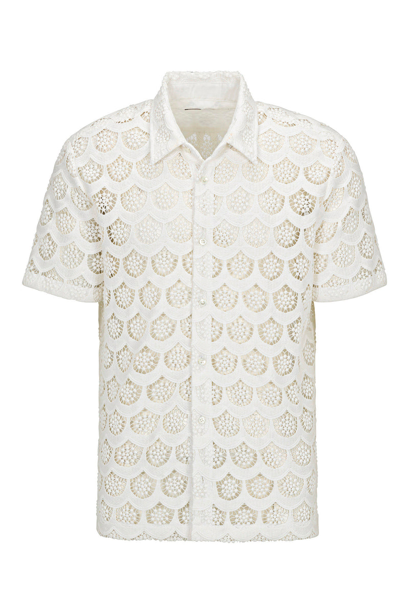The Branson Short-Sleeve Shirt - Crochet Lace is a white, semi-sheer button-up with a pointed collar and scallop-patterned open lace design.