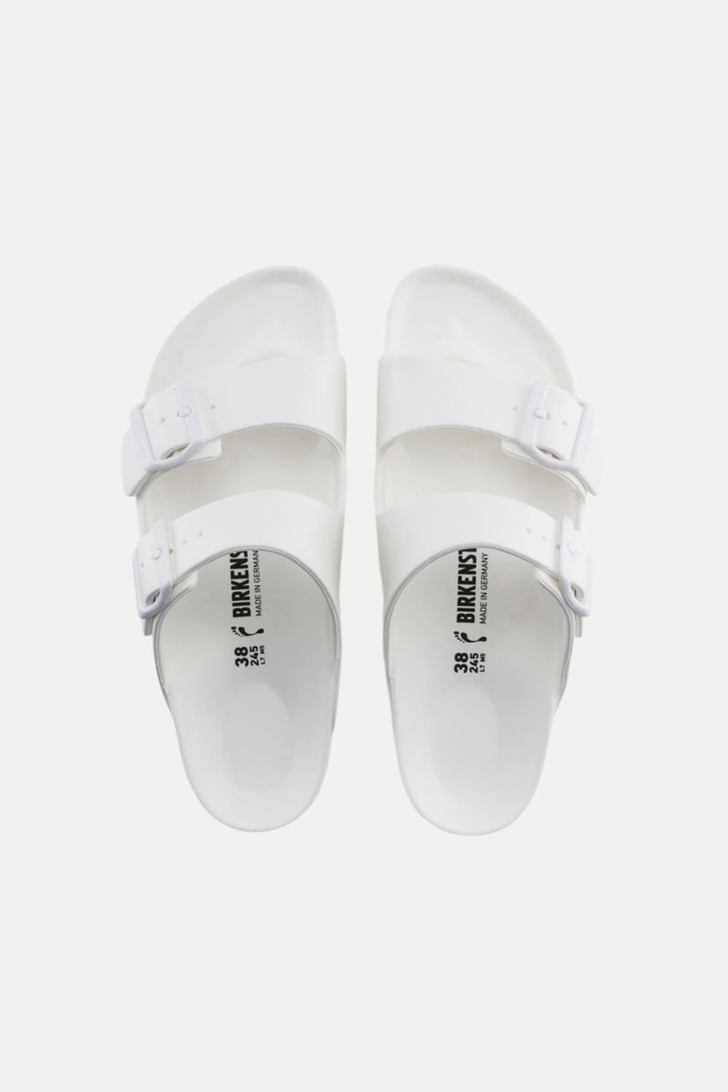 A pair of Mens Arizona White Eva Slide Sandals with two adjustable buckle straps on each shoe, viewed from above against a plain white background.