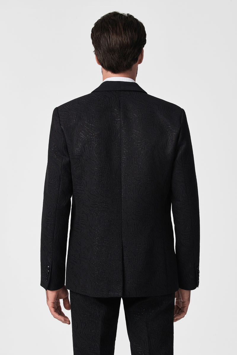 A man showcases the back view of the Thurston Blazer in black, standing with his back to the camera against a plain white background.