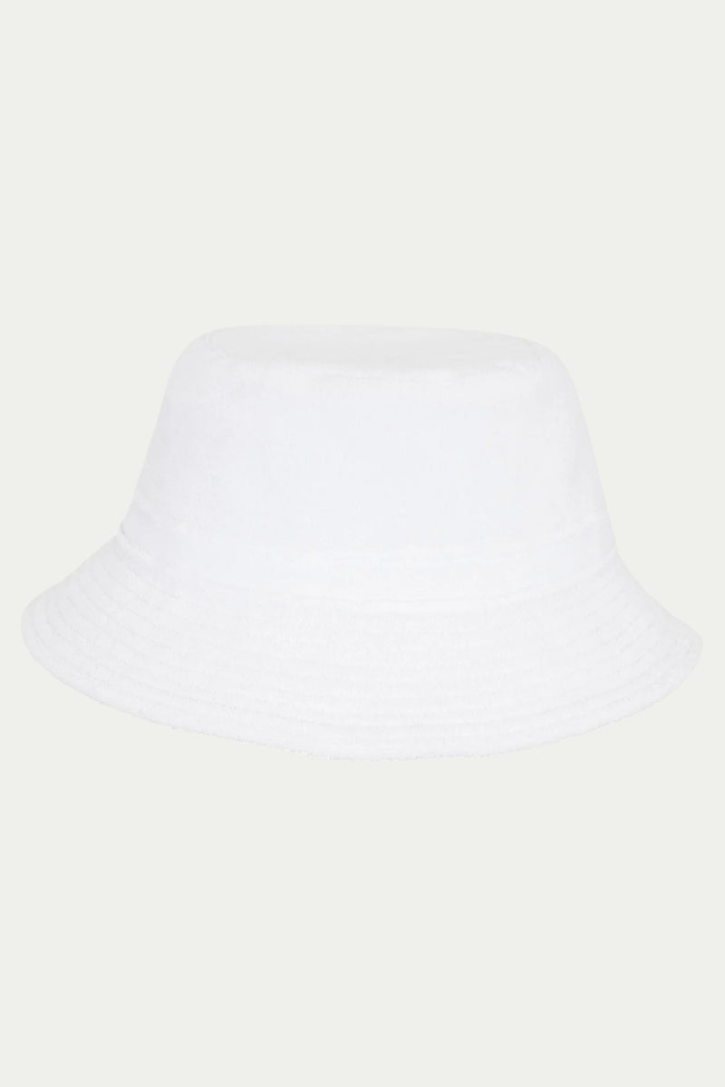 The Gilligan Bucket Hat - Linsk Terry in white, featuring a wide, downward-sloping brim, is displayed on a light gray background.