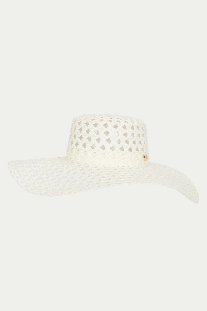 The TT Poolside Gossip White Wide-Brim Sun Hat features a flat crown and small circular cutouts in its woven straw material, shown against a plain light background.