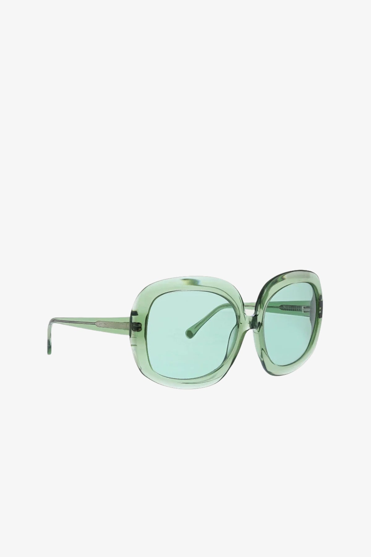 Bedarra Sunglasses in light green feature a translucent, thick, rounded frame with matching green-tinted lenses and wide arms, displayed on a plain white background.