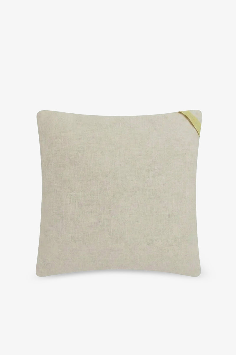 The Calexico Embroidered Square Pillow is a rectangular beige pillow with a subtly textured fabric and a small yellow corner tag, shown against a white background. It features a 20″x20″ pillow cover and plush down feathers for enhanced comfort.