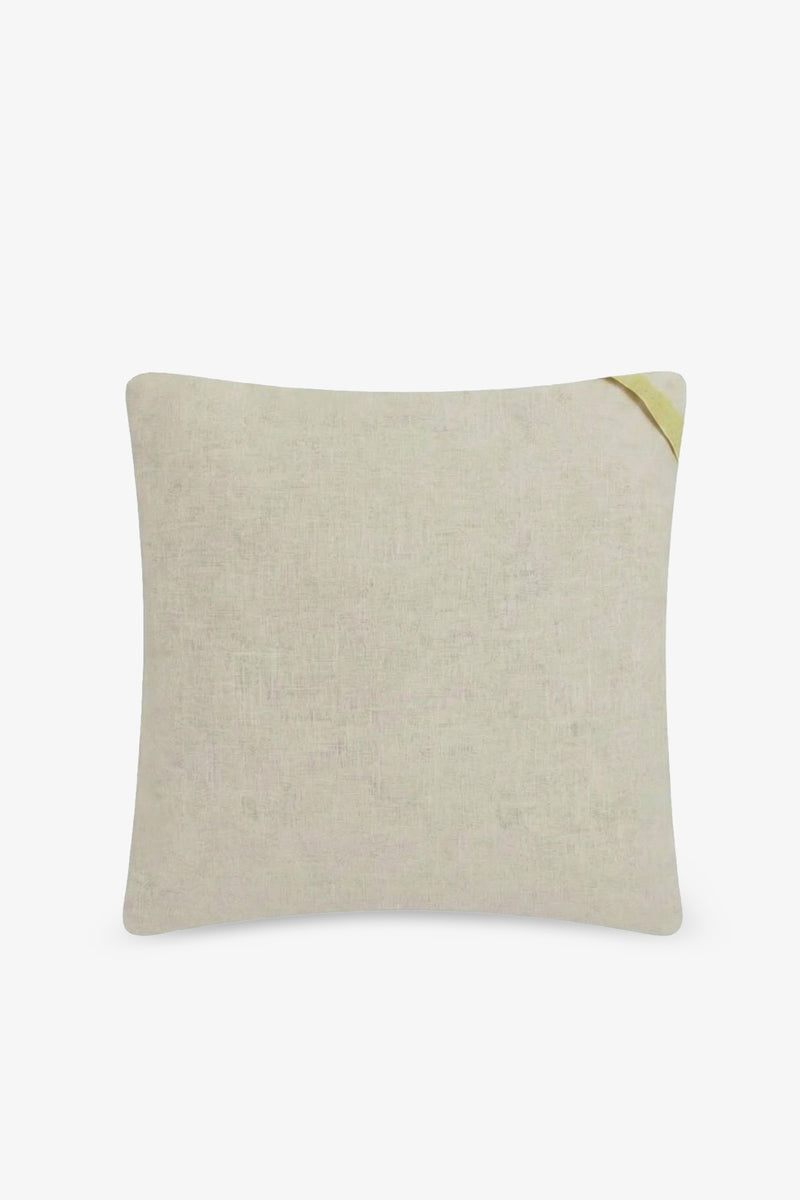 The Monterey Embroidered Square Pillow features a beige fabric with a subtle texture and a small yellow fabric tag on the top right corner, displayed against a plain white background.