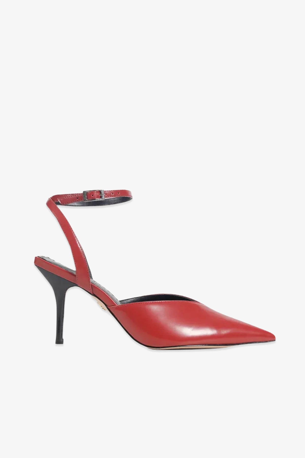 A side-profile view of the Paula Torres Cannes Pump showcases its red pointed toe, ankle strap, and slim black heel against a white background—perfectly embodying the elegance and allure of this luxury shoe.