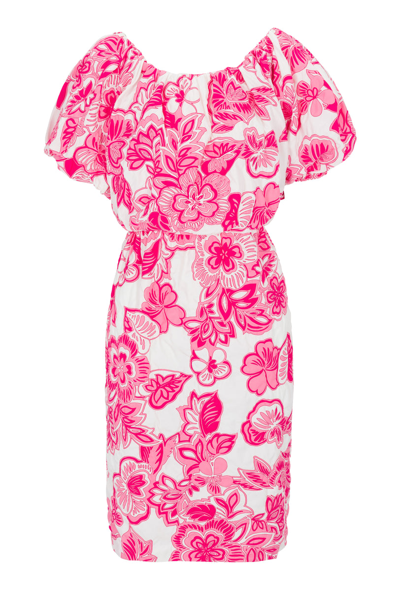 The Tatiana Dress is a white dress featuring an elastic waist, short puffed sleeves, and a vibrant pink floral pattern all over.