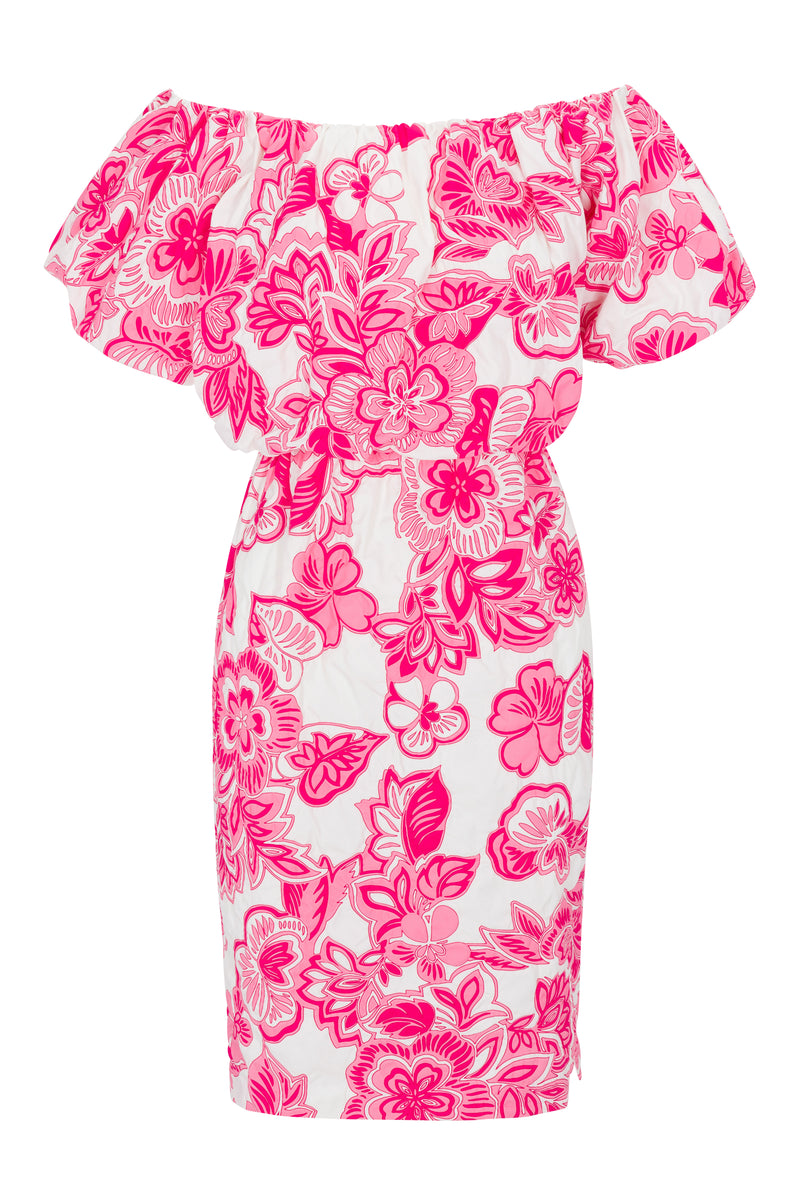 The Tatiana Dress is a white off-the-shoulder dress with short ruffled sleeves, showcasing a bold pink floral pattern throughout.