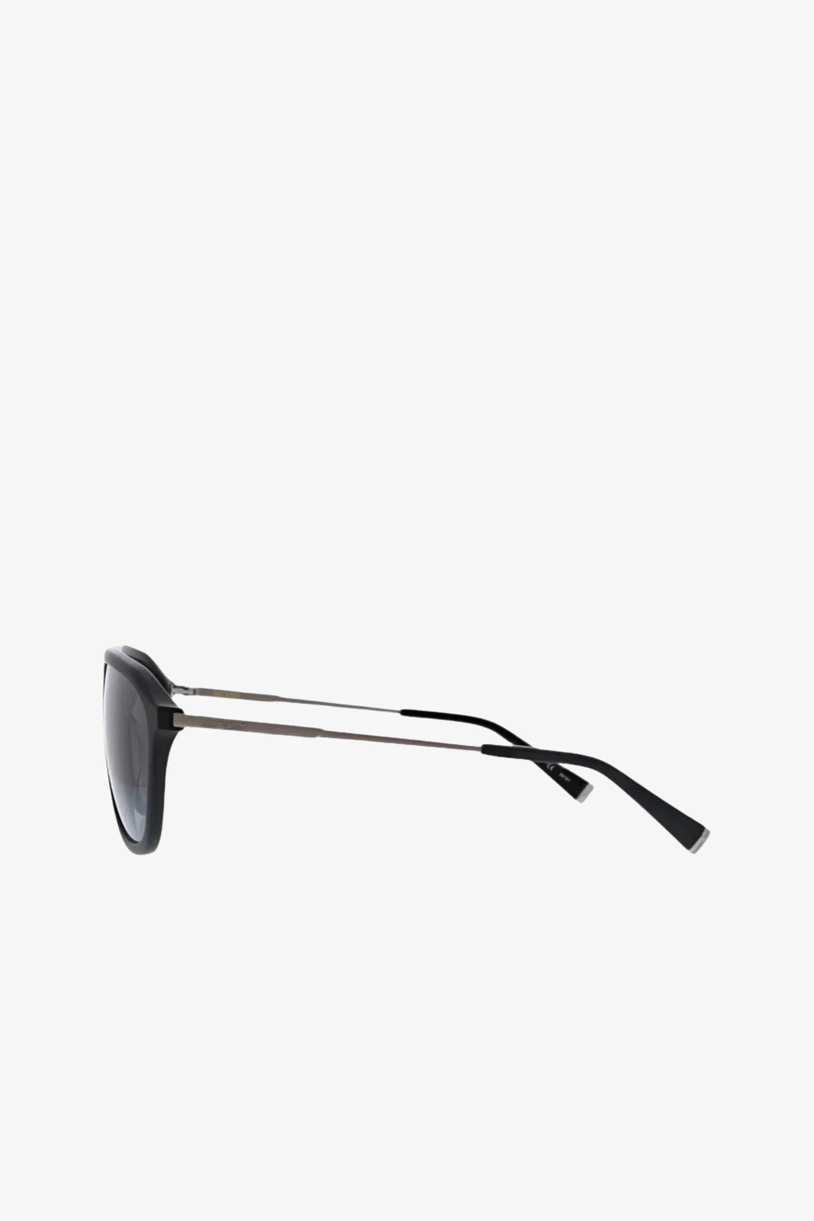 Side view of Stern Sunglass in black aviator style, featuring thin silver metal arms and dark UV-protective lenses, set against a plain white background.