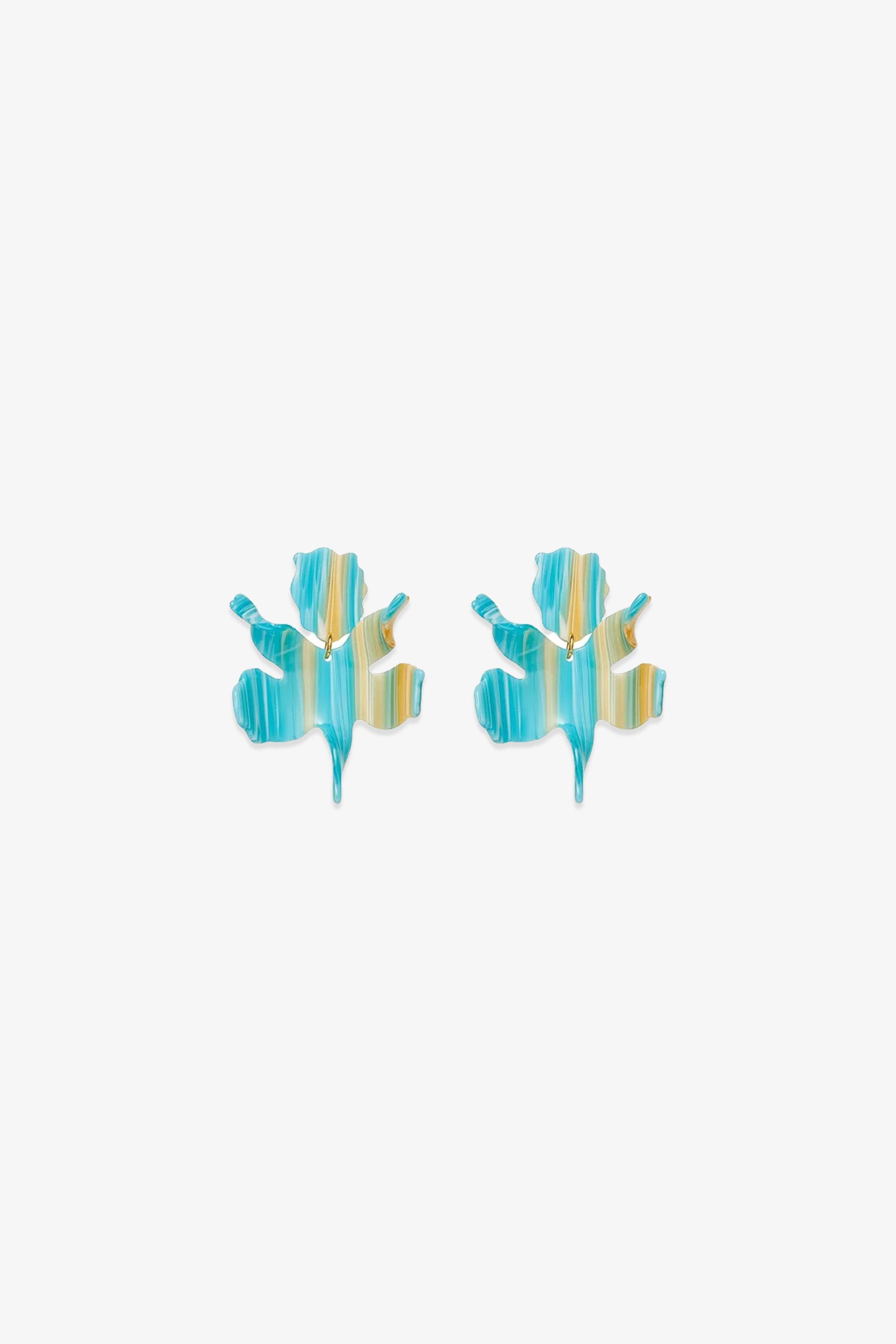 The Paper Lily Earrings are a pair of leaf-shaped statement earrings crafted from hand-swirled acetate with blue, teal, and yellow stripes, shown against a plain white background.