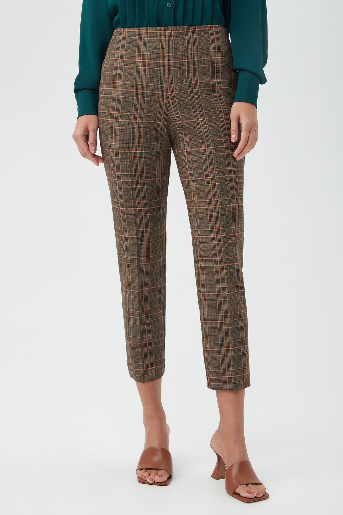 A person wears the Masego Pant in Multi with a dark green long-sleeve shirt and brown heeled sandals, standing against a plain light background. The face is not visible.