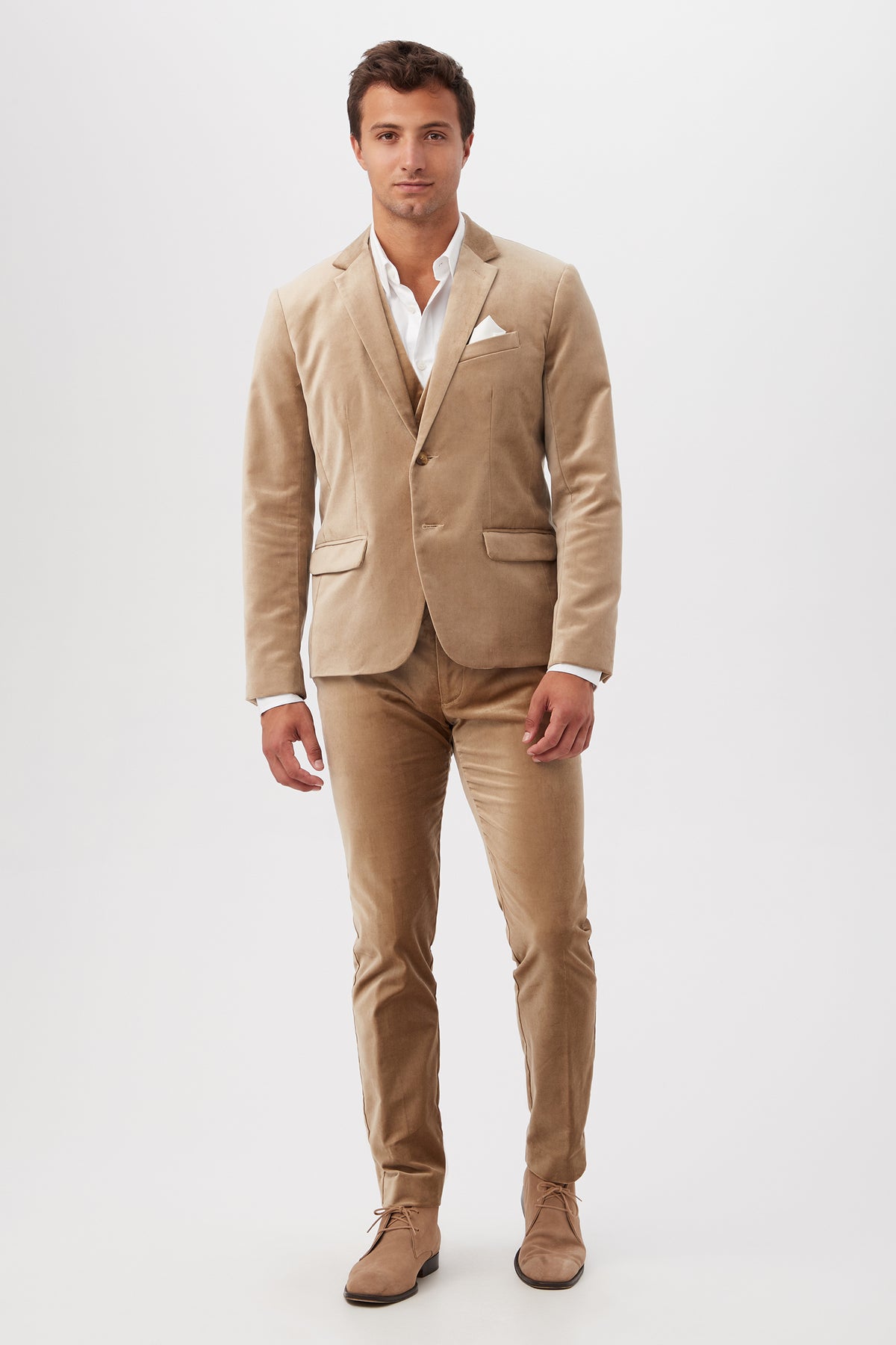 A man stands facing forward, wearing the Thurston Blazer in Gold Velveteen over a white dress shirt, no tie, and matching suede shoes. He looks confident with a neutral expression against a plain white background.