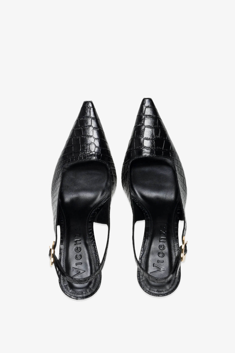 The Naomi Slingback Heel is a pair of black, pointed-toe slingback shoes featuring a crocodile texture and low heels, displayed from above on a white background.