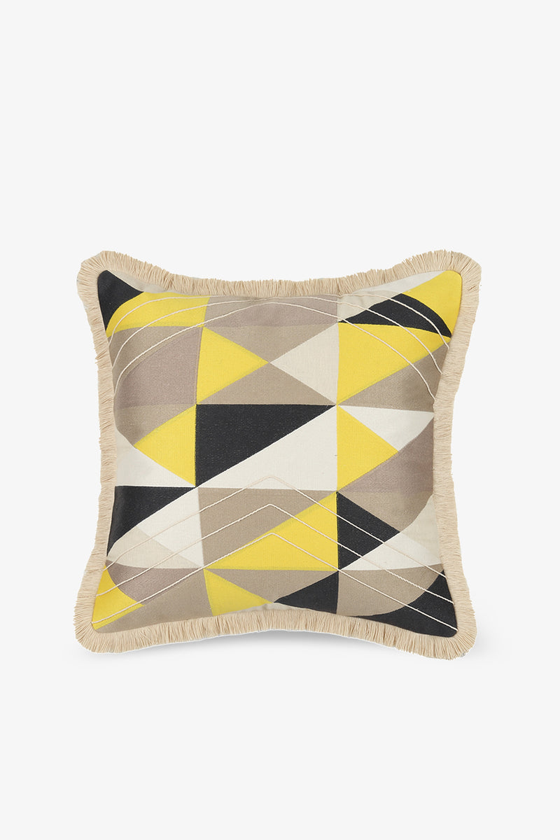Colfax Embroidered Square Pillow in yellow features a geometric triangle pattern in yellow, black, gray, and white, beige fringe trim on the edges, and a white background.