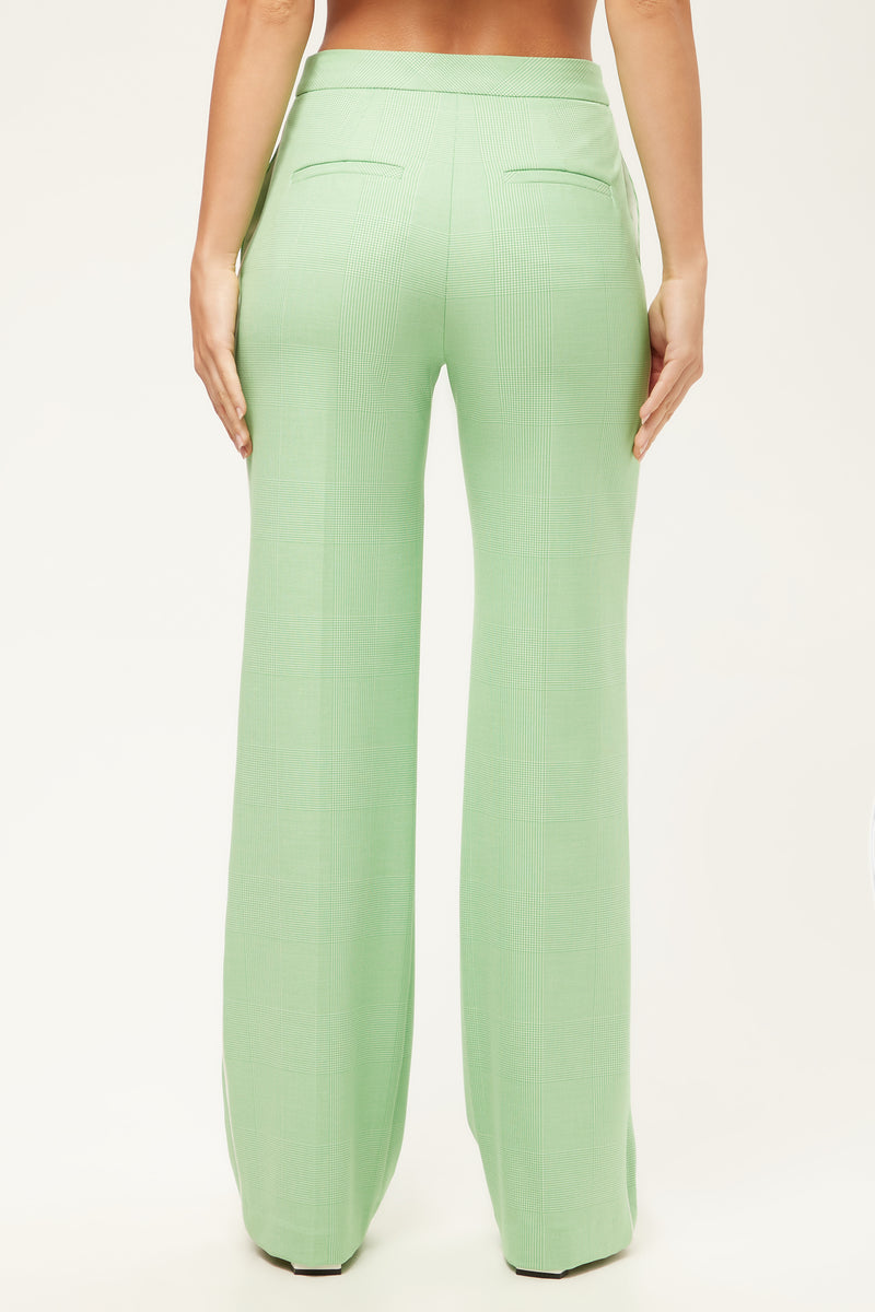 A person is shown from the back, wearing the Bjorn Wide-Leg Pant in Game Time Glen Plaid, featuring a high waist, wide legs, and two back welt pockets, standing against a plain white background.
