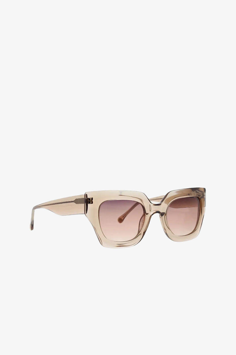 Sol Wide Frame Square Acetate Sunglasses in beige feature oversized square silhouettes with thick translucent frames and light brown gradient lenses, displayed at an angle on a white background.