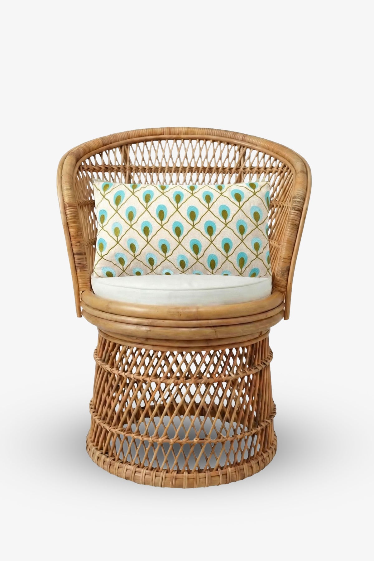 Round rattan chair with an open woven design, featuring a circular cushion and the Roseville Embroidered Lumbar Pillow—adorned with a colorful peacock feather pattern—set against a plain white background.