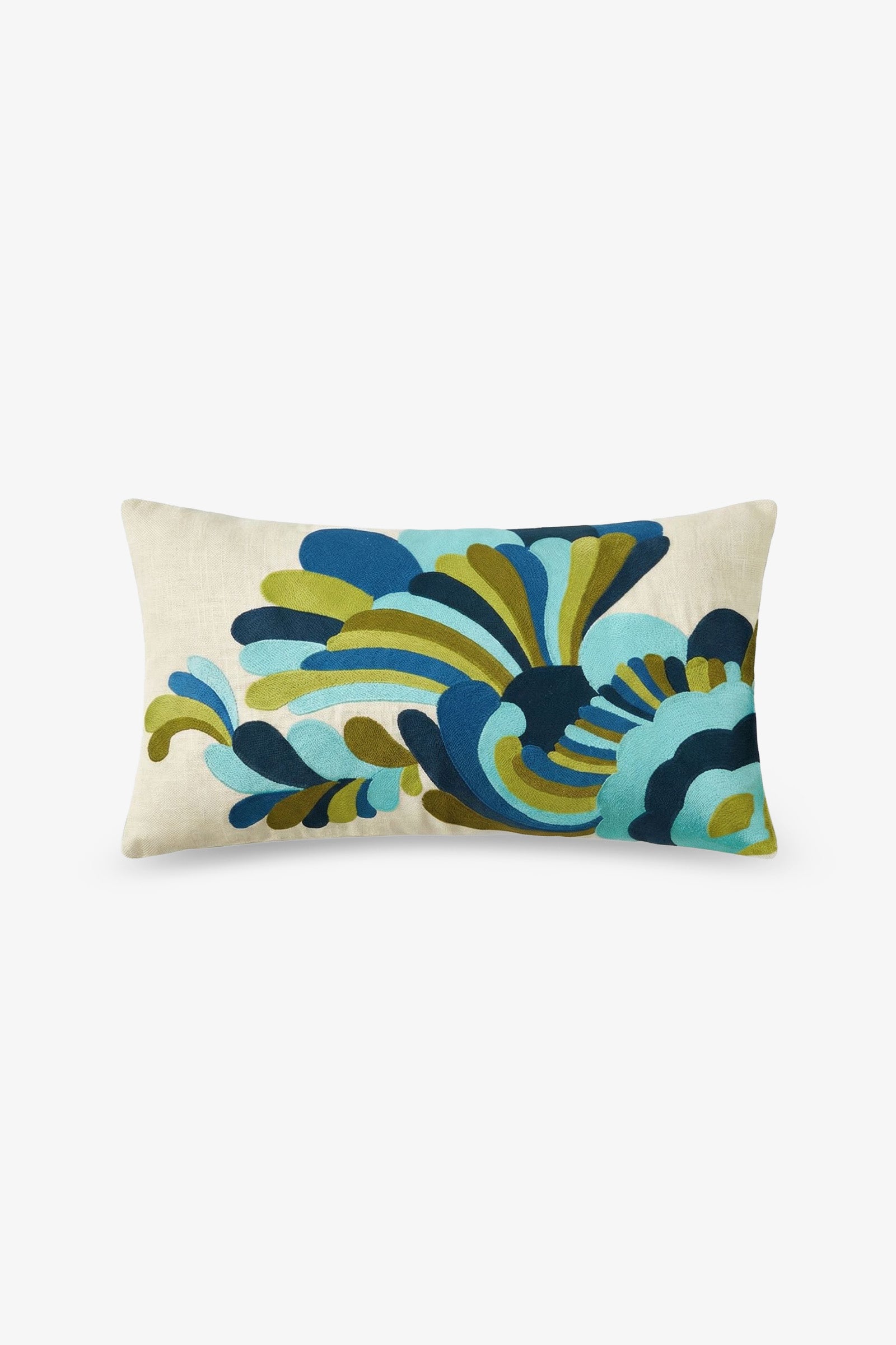 The Escondido Embroidered Lumbar Pillow features a cream background adorned with a bold abstract floral design in shades of blue, teal, green, and navy. The embroidered pattern spans most of the pillow’s surface.