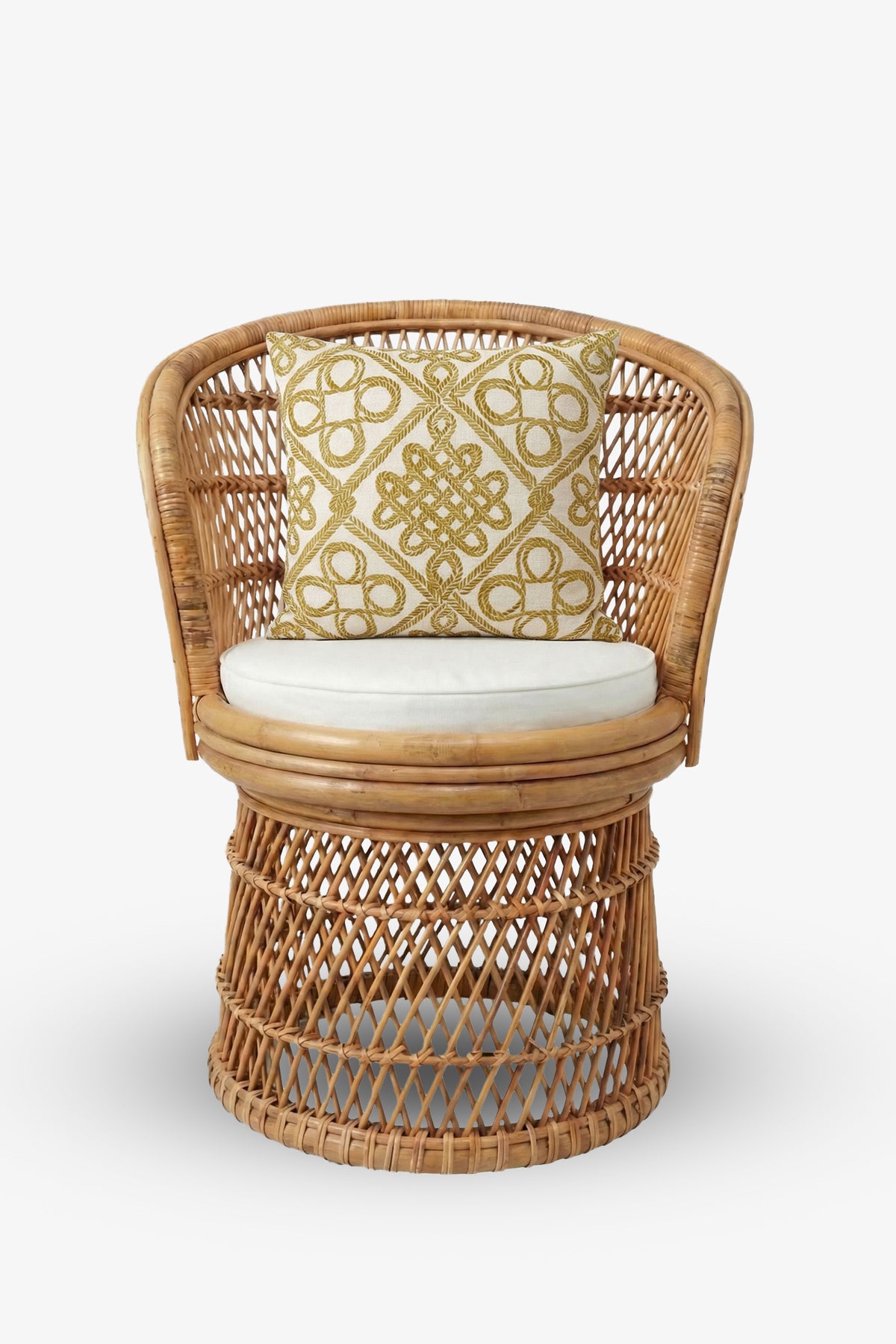 A round wicker chair with a curved backrest and a white cushion is adorned with the Costa Mesa Embroidered Square Pillow, which features a yellow geometric pattern. The chair is displayed against a plain white background.