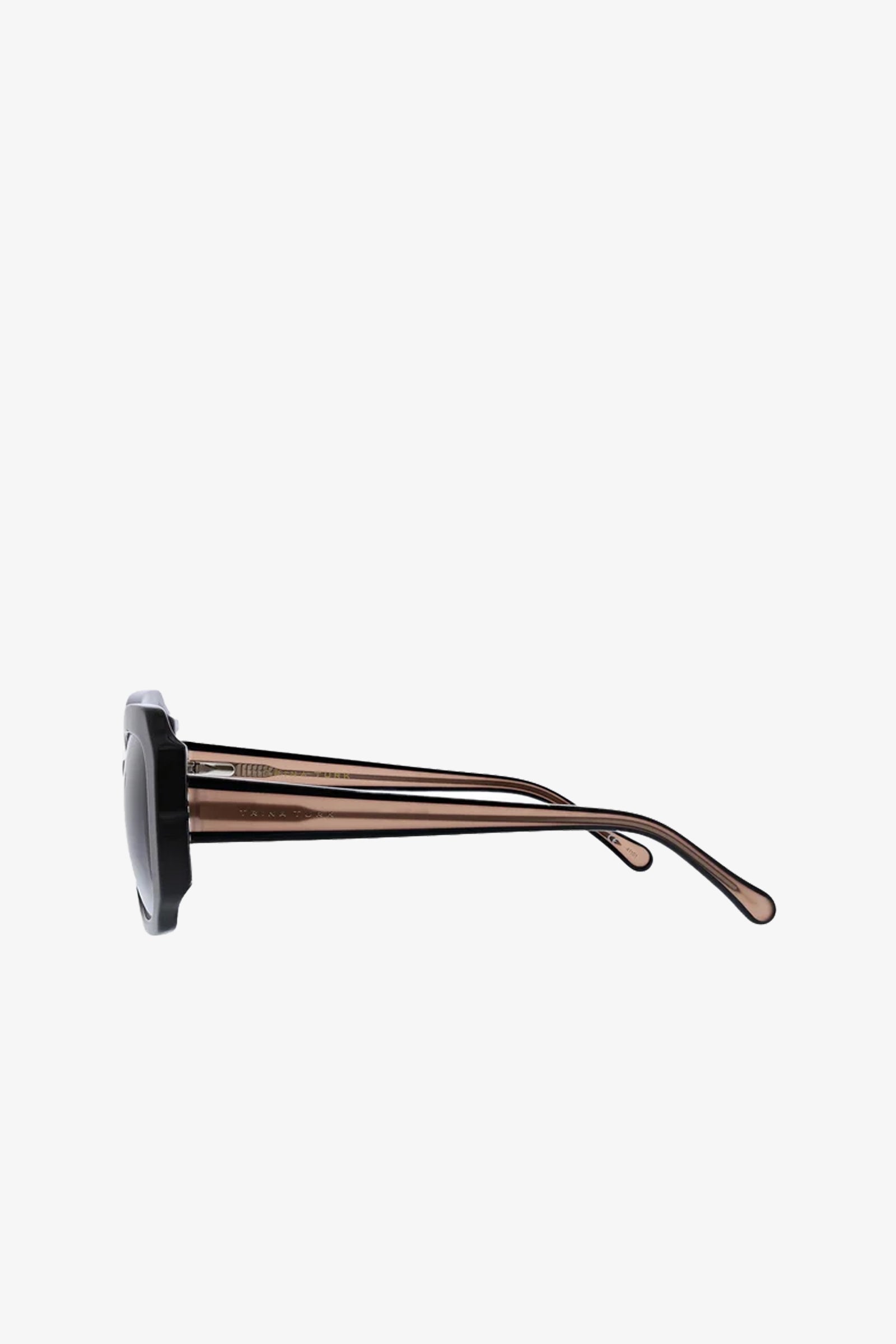 Side view of the Sandbanks Oversized Sunglasses featuring dark circular frames and translucent brown arms, displayed on a plain white background.