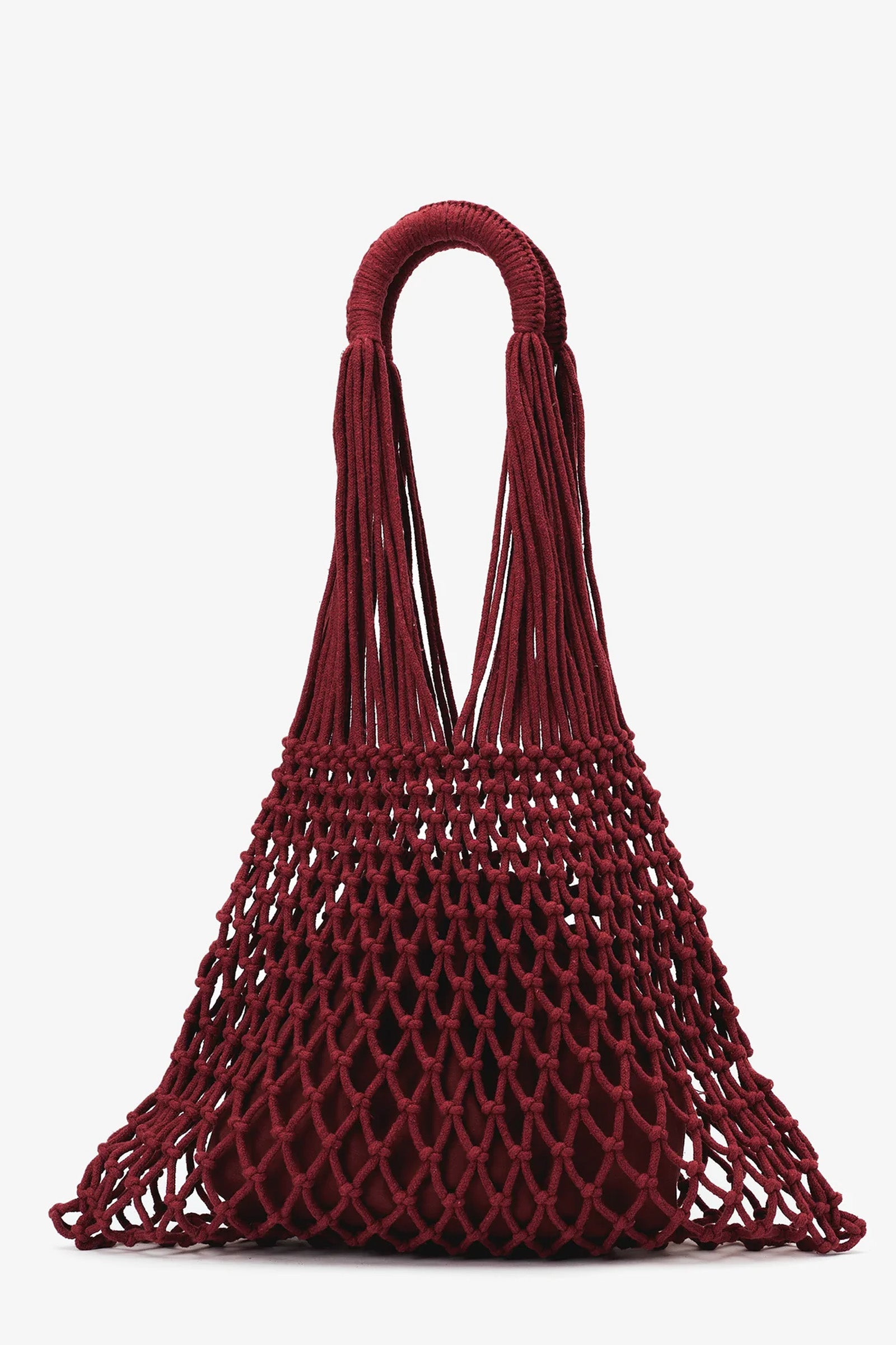 The Nannacay Alessandra Woven Bag is a burgundy netted handbag with thick handles and a drawstring-style pouch nestled inside its mesh exterior.