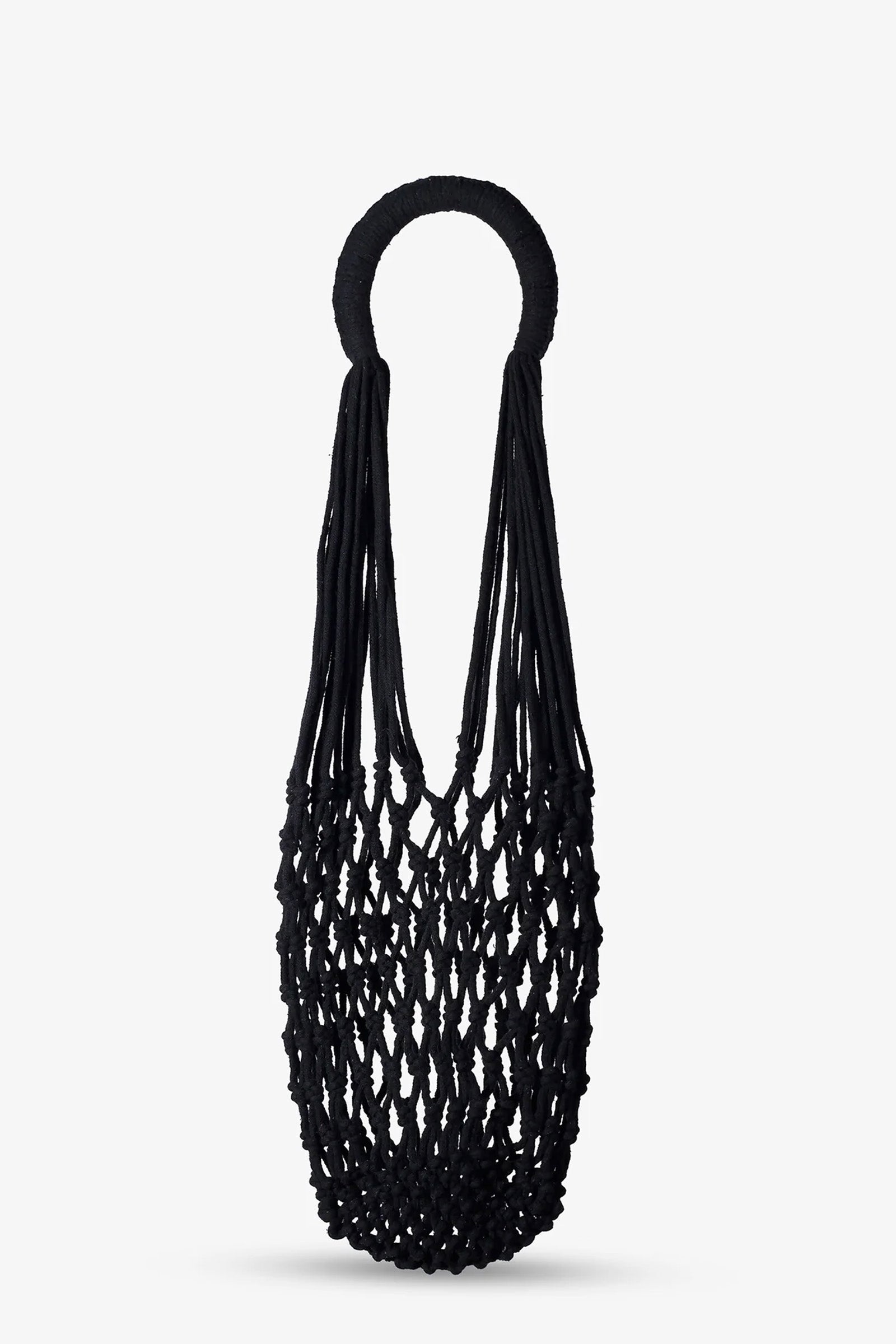 The Nannacay Kim Woven Bag, featuring a black netted design with round handles and crafted from knotted material, is displayed against a plain white background.