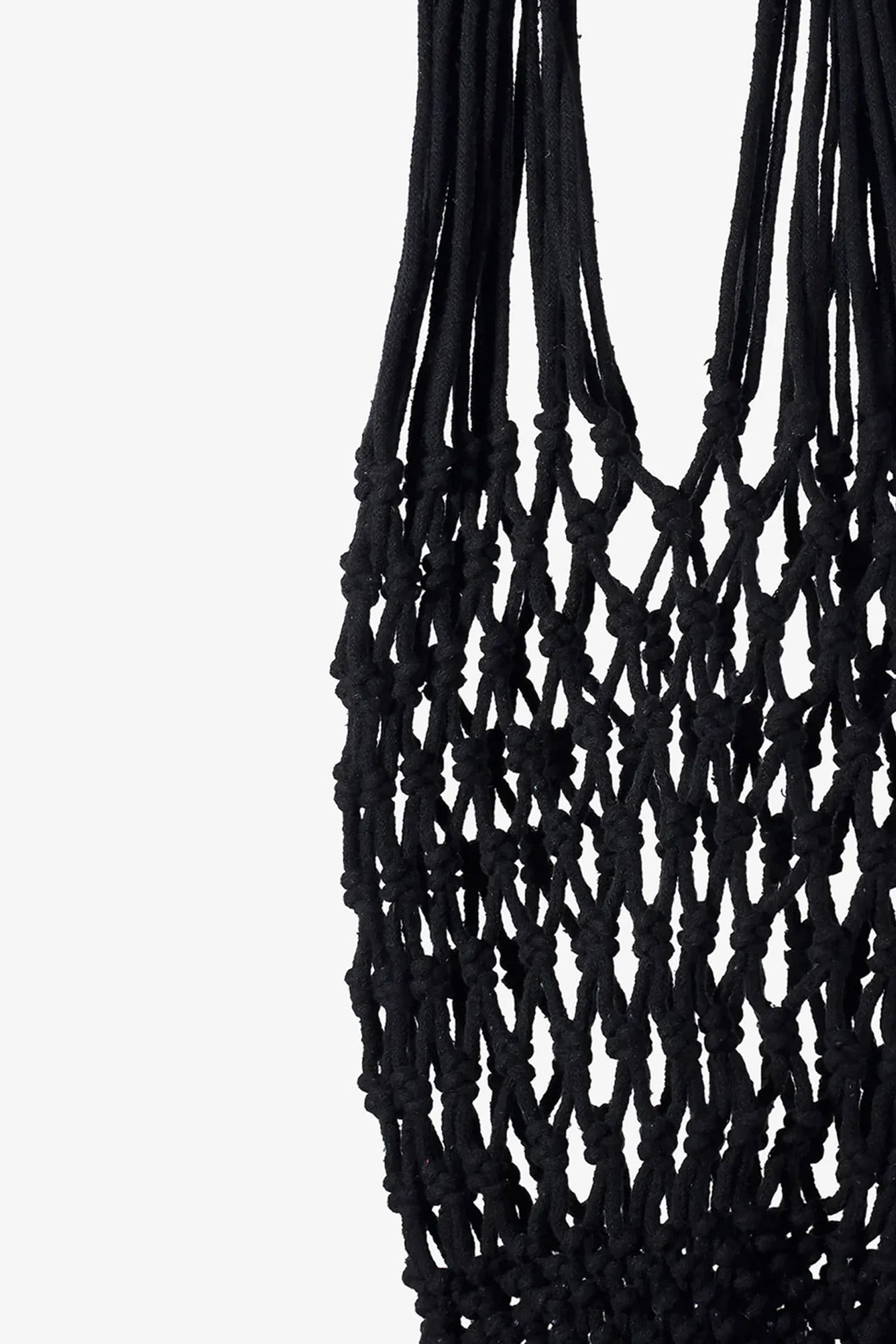 Close-up of the Nannacay Kim Woven Bag in black, featuring intricate knotted macramé cord patterns and loops against a white background.
