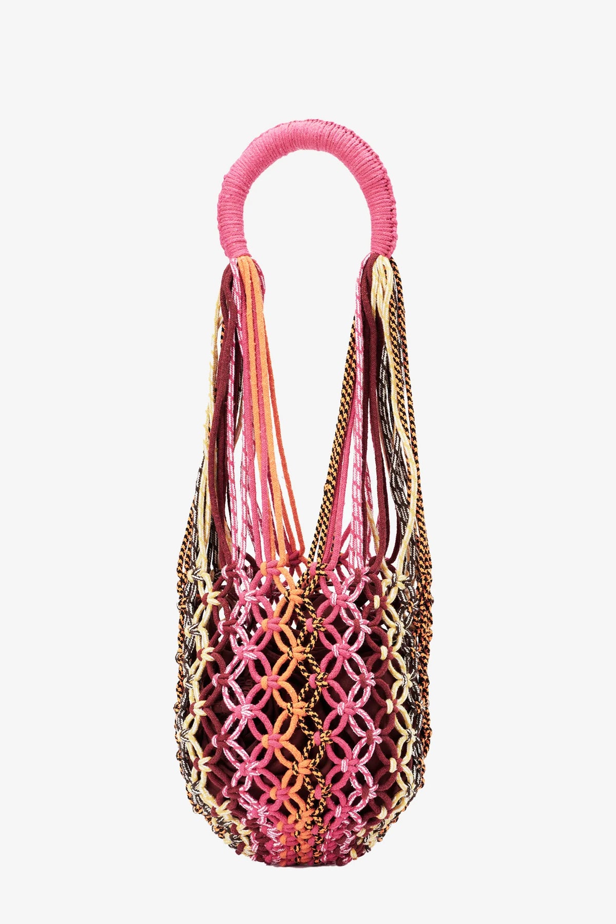 The Nannacay Kim Woven Bag is handwoven with an intricate lattice pattern in pink, yellow, and brown cords, featuring a wrapped round handle and an open top, displayed against a white background.