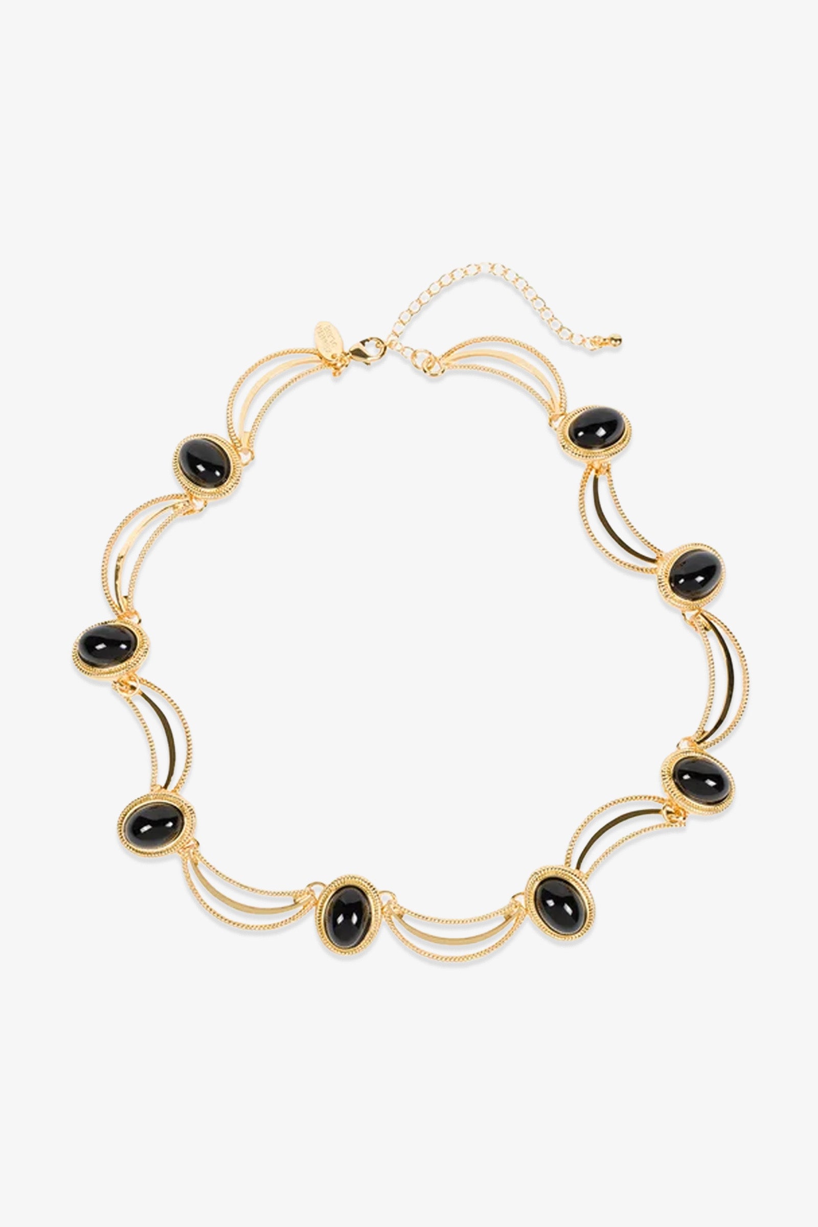 Introducing the Oval Jet Scallop Necklace: a gold necklace featuring evenly spaced black oval stones, each cradled in a gold frame and linked by delicate, curved gold strands. Finished with an adjustable clasp at the top for a perfect fit.
