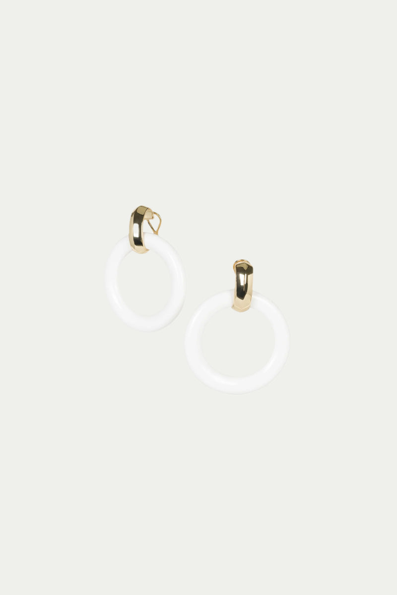 TT x KJL Doorknocker Earrings in white feature modern circular hoops with gold-toned clasps, shown against a plain light background.