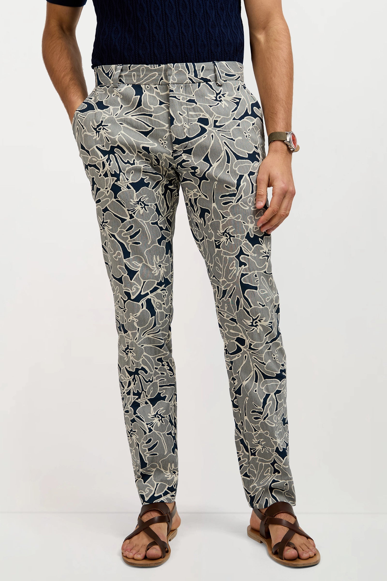 Someone wearing the Clyde Slim Trouser in Artsy Floral Jacquard.