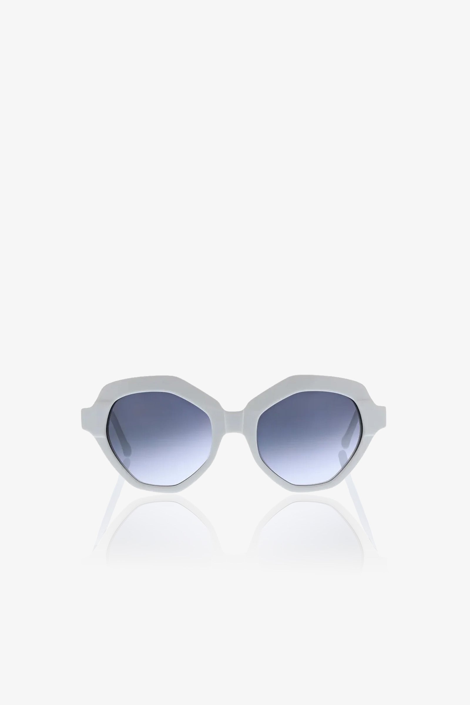 The Ipanema Sunglasses feature white geometric, angular frames and blue gradient lenses, showcased against a plain white background.