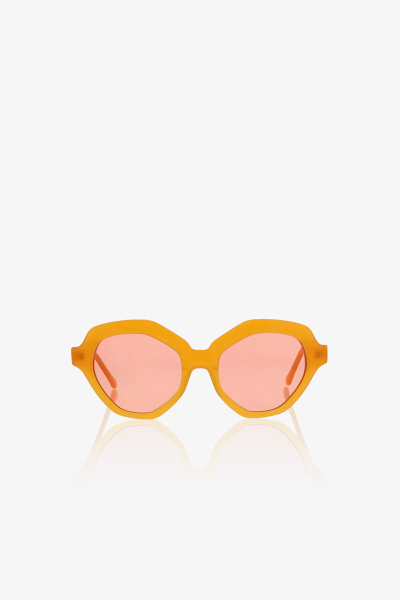 Ipanema Sunglasses with thick orange frames and pink-tinted oval lenses, displayed on a white background.