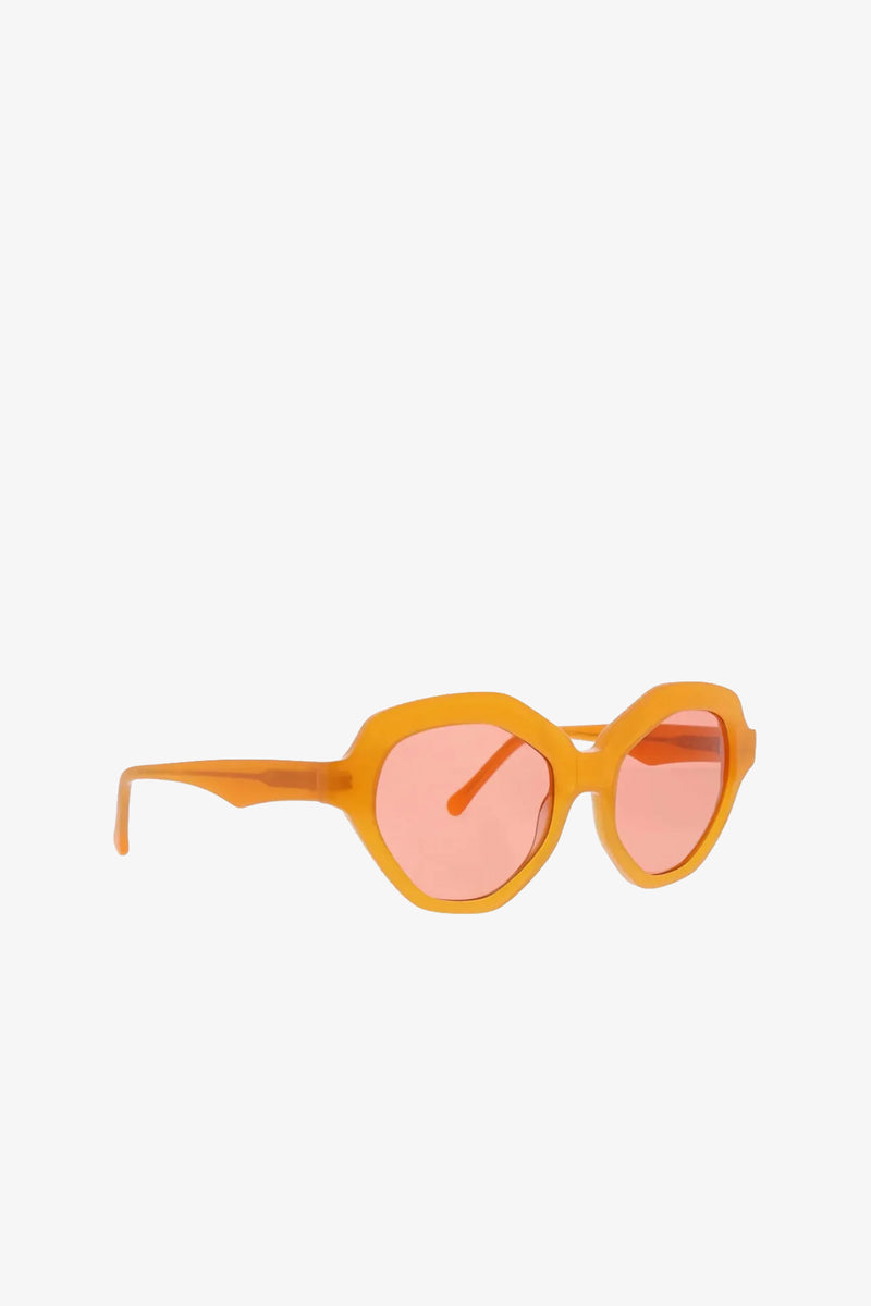 Ipanema Sunglasses in an orange geometric frame with tinted pink lenses, displayed on a white background.