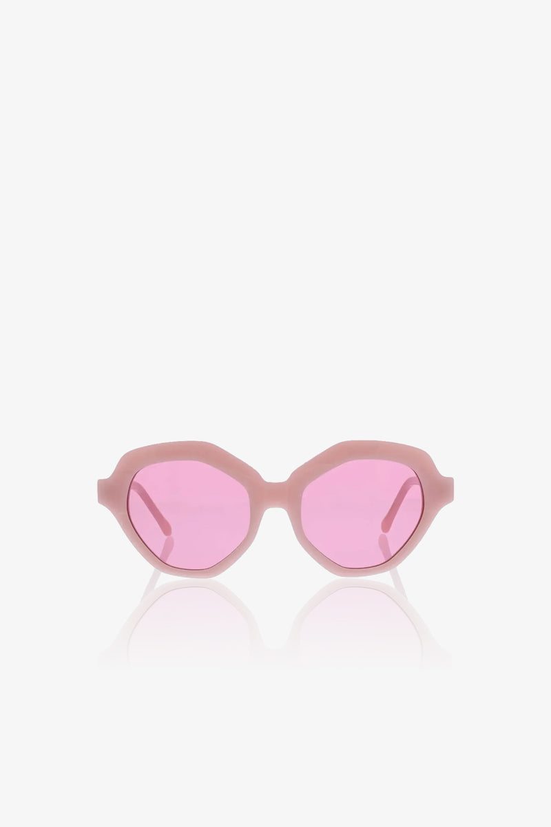 The Ipanema Sunglasses feature a thick, light pink oval frame with pink-tinted lenses, displayed on a plain white background.