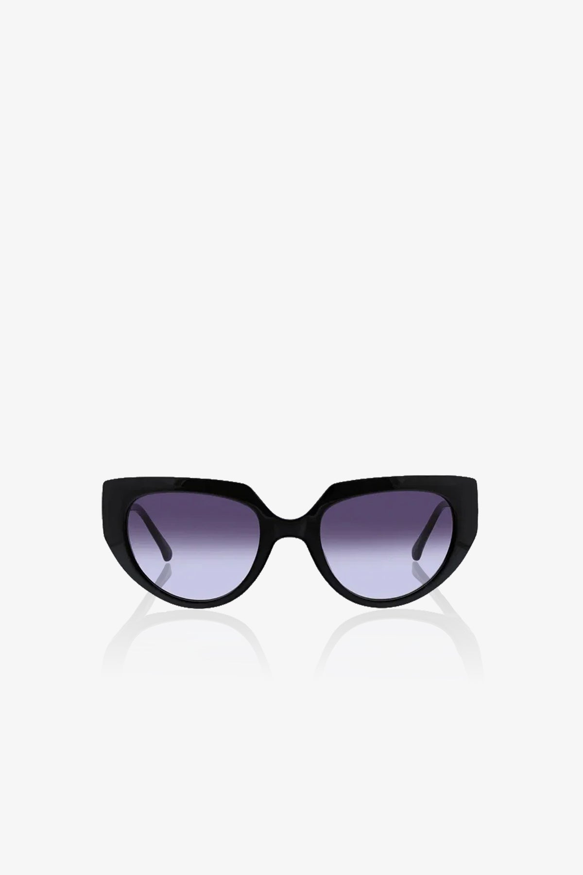Schooner Sunglasses with a subtle cat-eye frame and dark, slightly gradient lenses are displayed against a plain white background, facing directly forward. The arms of the sunglasses extend outward and backward.