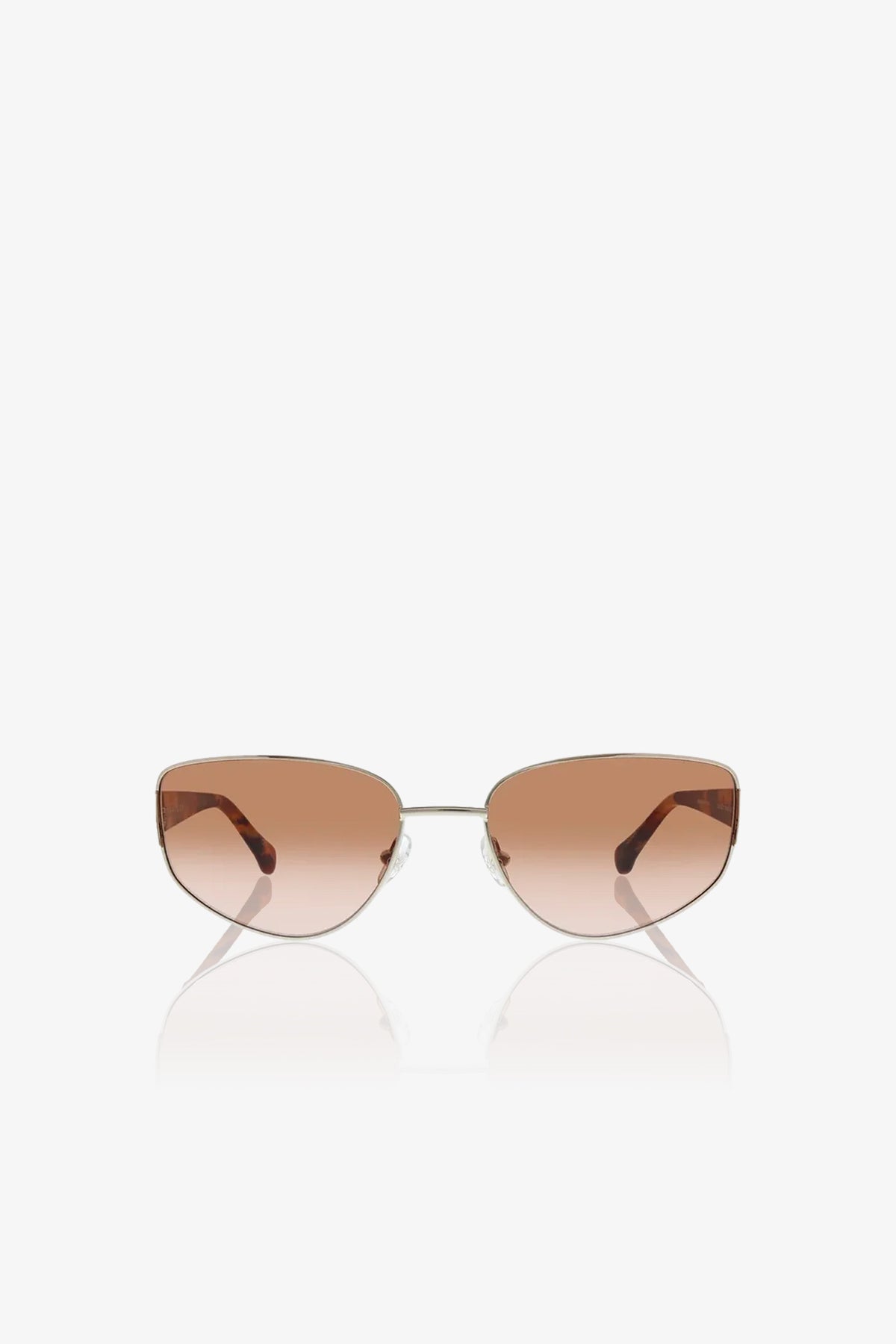 The Dunes Sunglasses feature brown-tinted, cat-eye shaped lenses and thin metal frames, shown against a white background.
