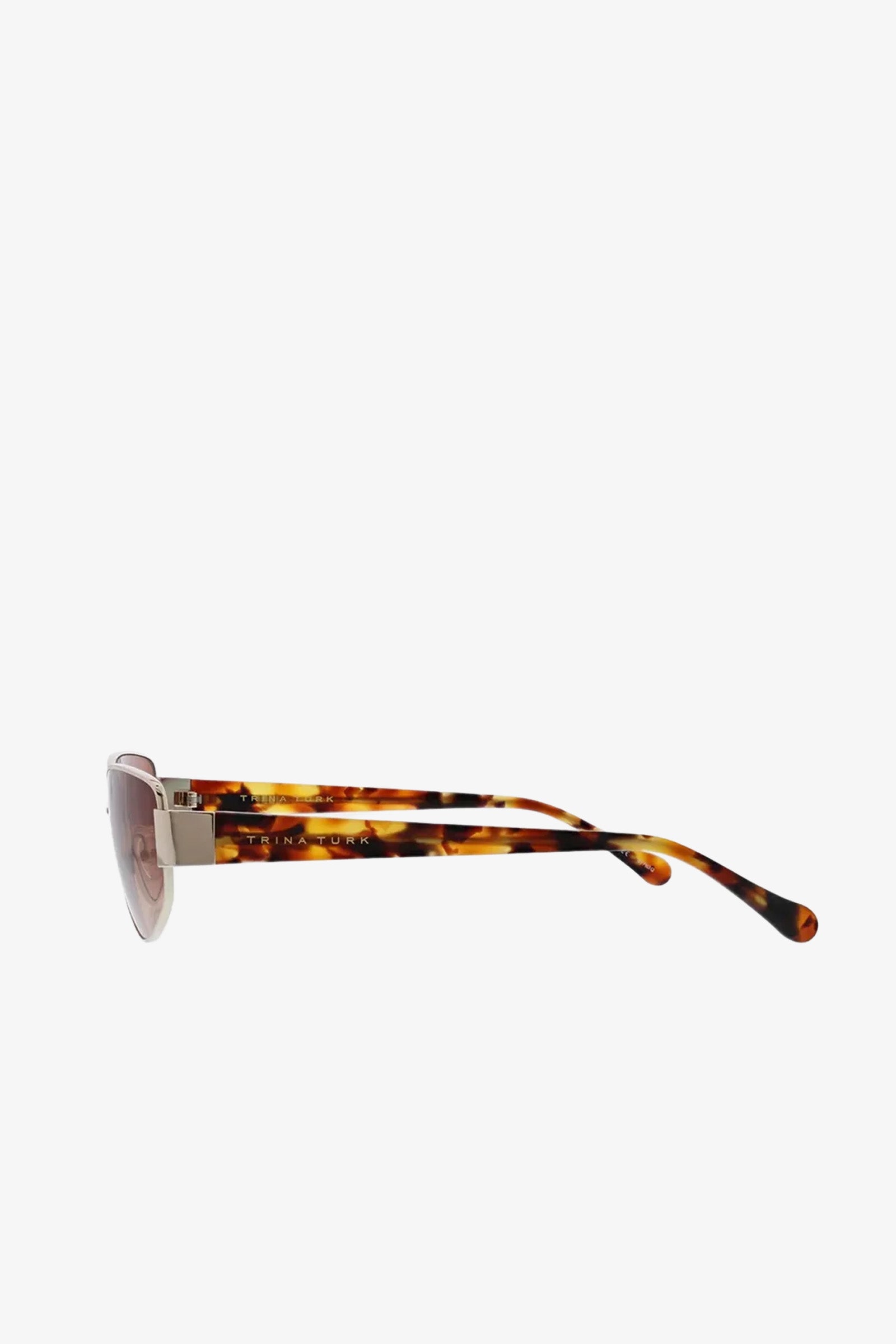 Side view of the Dunes Sunglasses featuring a tortoiseshell frame with gold accents and lightly tinted lenses, displayed against a plain white background.
