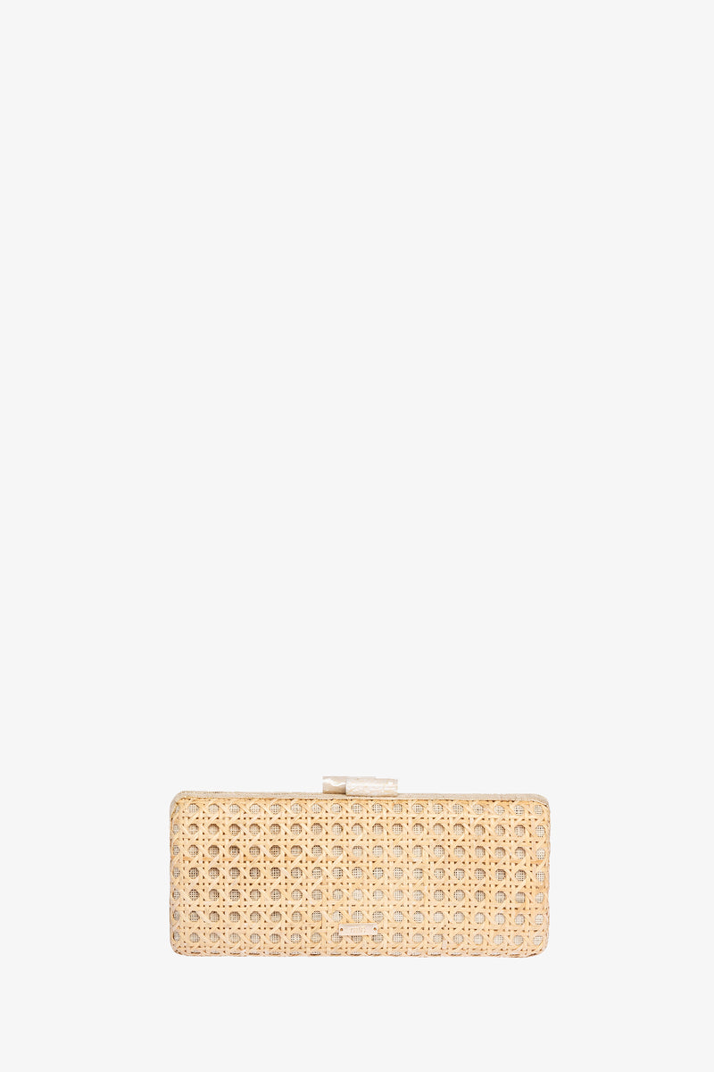 The Alessandra Rattan Long Clutch is a rectangular beige bag with a woven rattan texture and a small rectangular top clasp, shown on a plain white background.