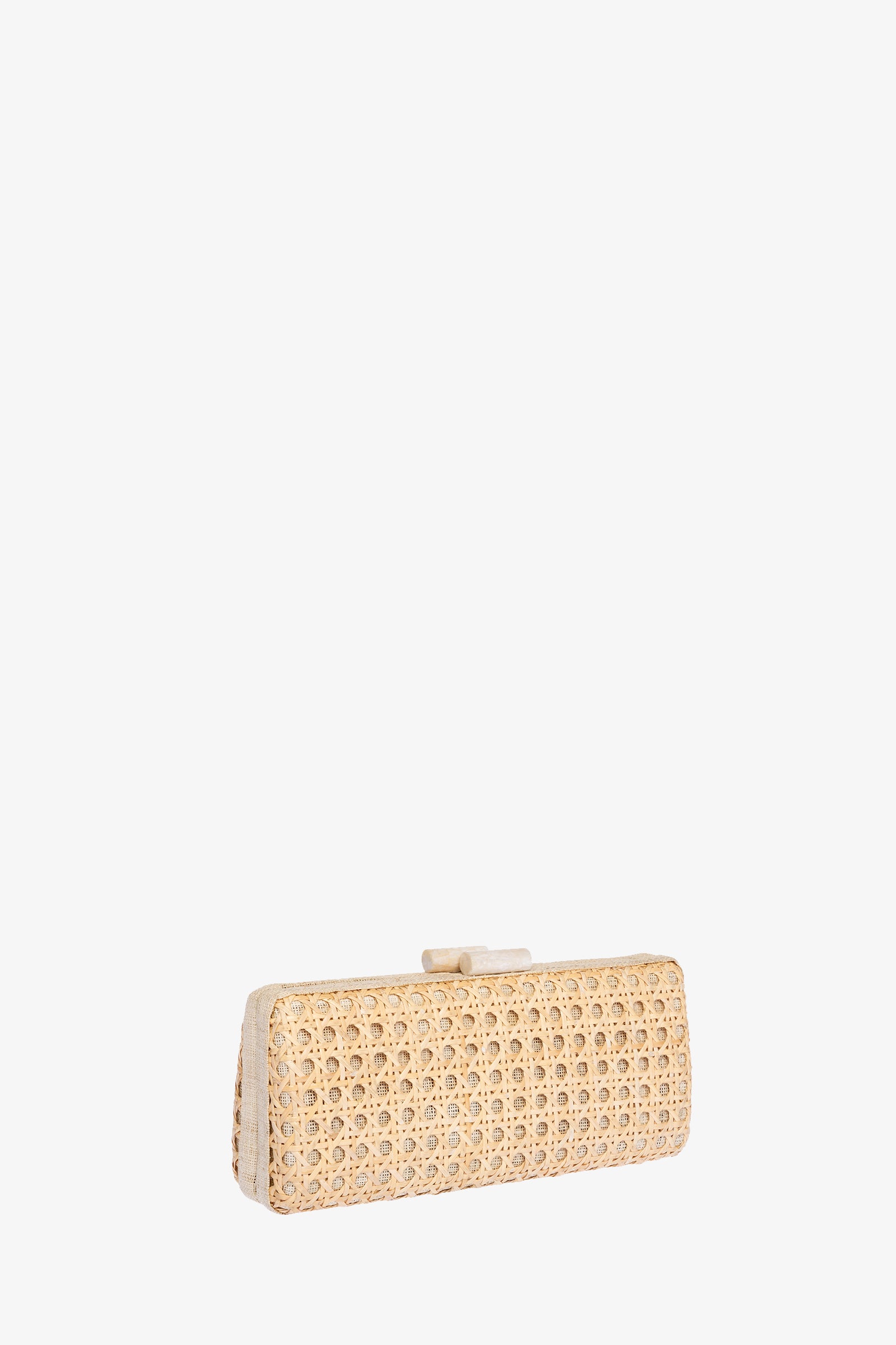 The Alessandra Rattan Long Clutch features a rectangular shape, light beige woven rattan texture, and a small top clasp, displayed on a plain white background.
