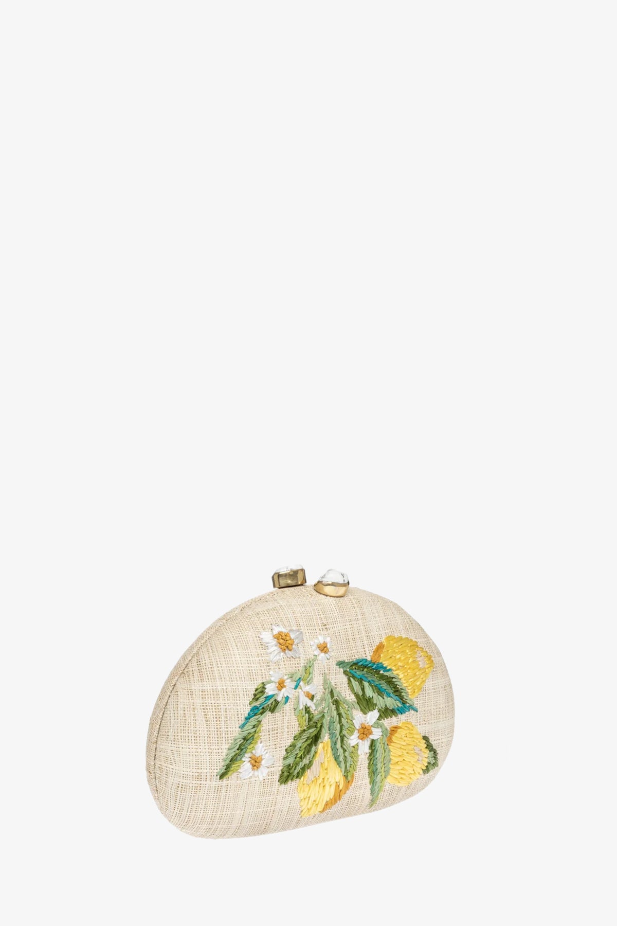 The RAFE BERNA LEMON CLUTCH is a beige, semi-circular clutch with a textured surface, embroidered yellow lemons, green leaves, white flowers, and a gold clasp at the top.
