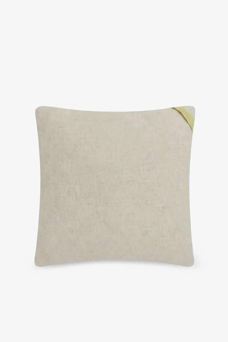 The Shante Embroidered Square Pillow is a rectangular beige cushion featuring a subtle textured design and a small folded yellow corner at the top right, displayed against a plain white background.
