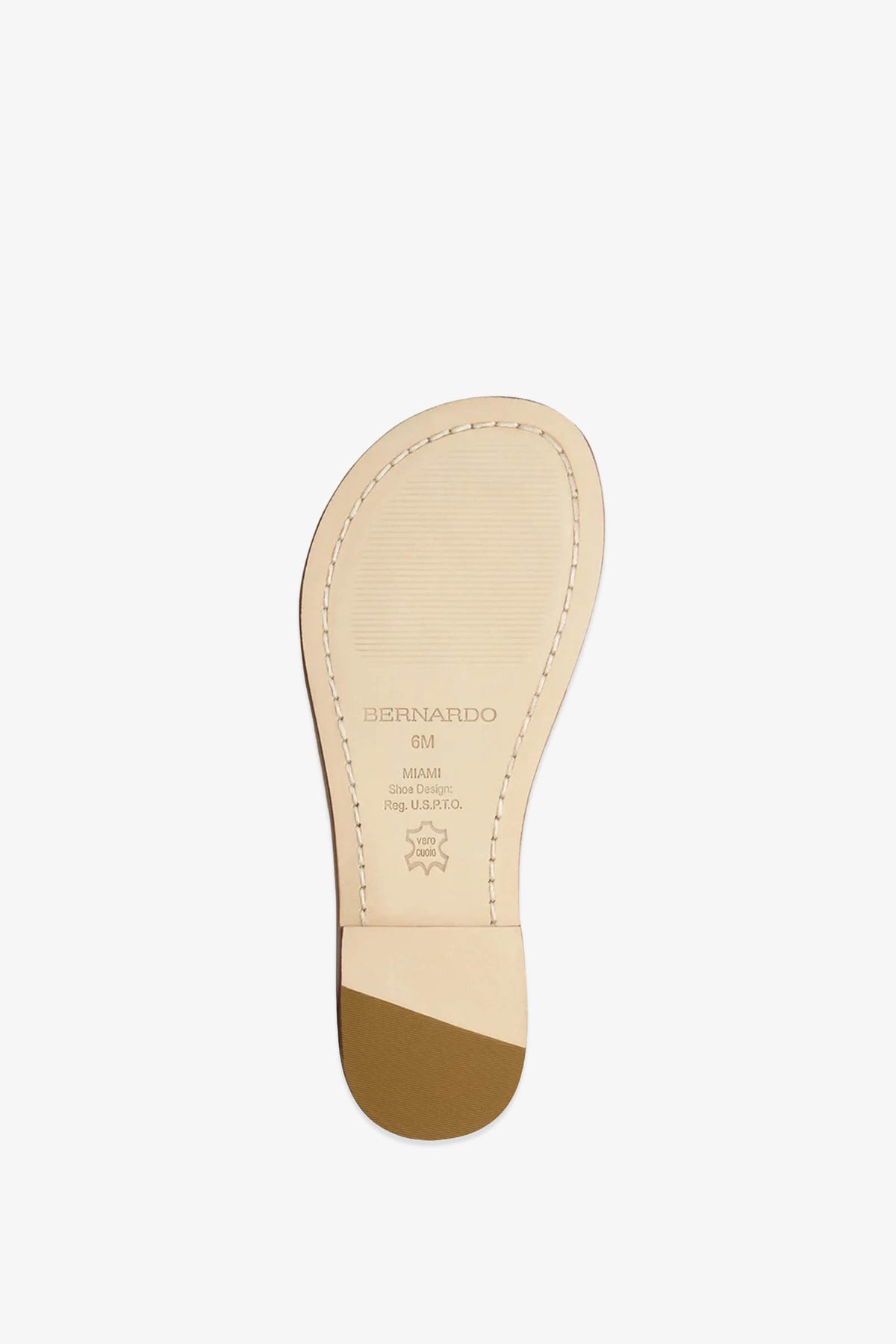 A light beige sole from the Miami Sandal with visible stitching, a brown heel tip, and the text “BERNARDO 6M MIAMI Hand Made From Juatao Leather” is shown against a white background.