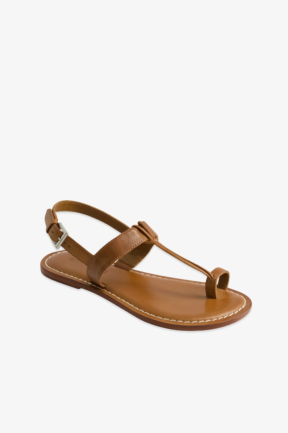 Maverick 2 Sandal: Brown leather sandal featuring a toe loop, ankle strap with buckle closure, and visible white stitching around the sole. Designed with a simple, minimalist aesthetic.