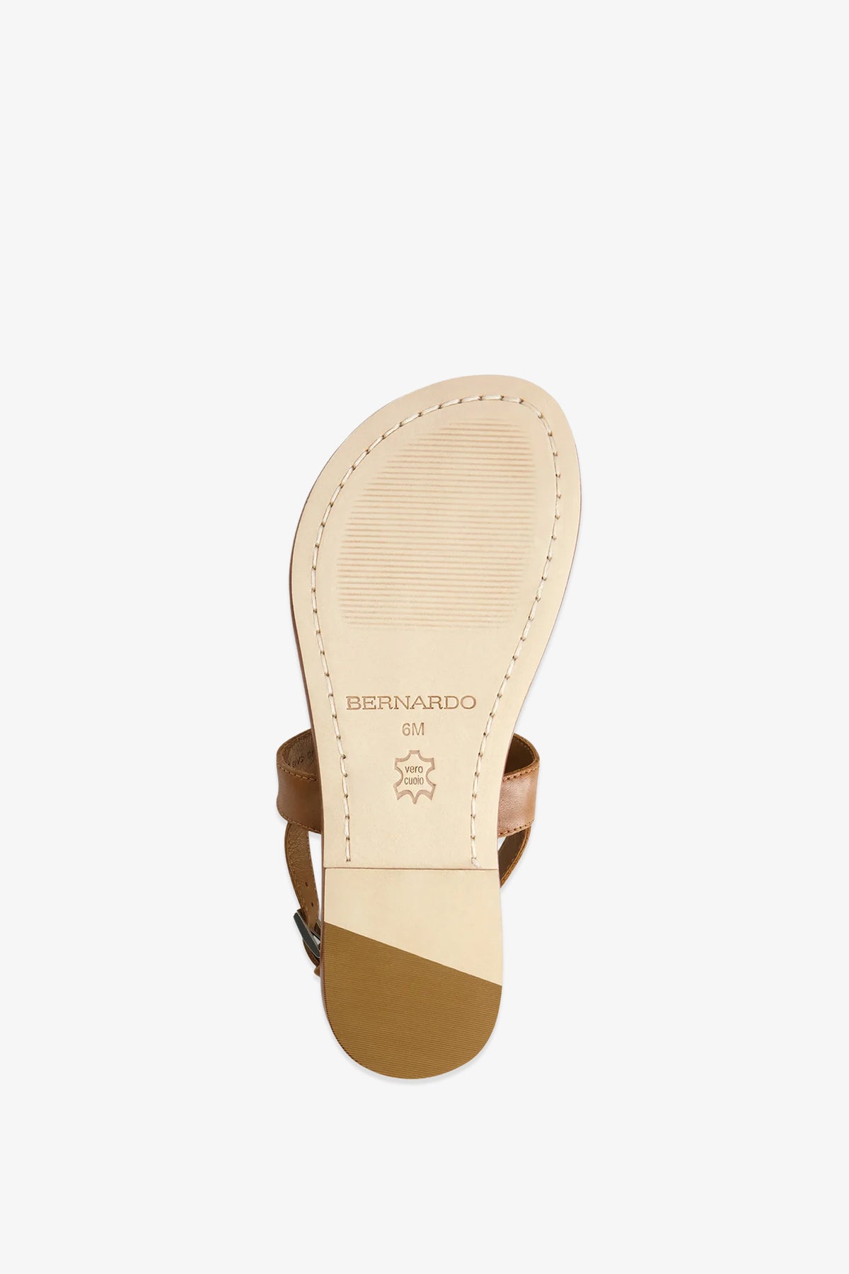 A tan leather Maverick 2 Sandal is shown from the bottom, displaying the sole with the Bernardo brand name, a leather symbol, and size marking 6M. The heel and stitching details are clearly visible.